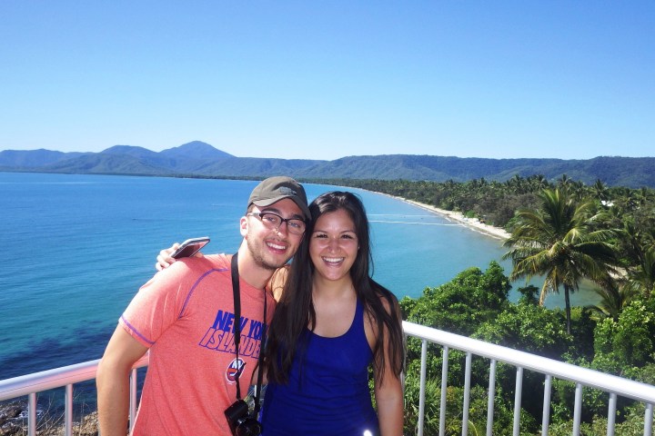 a person standing in front of a body of water