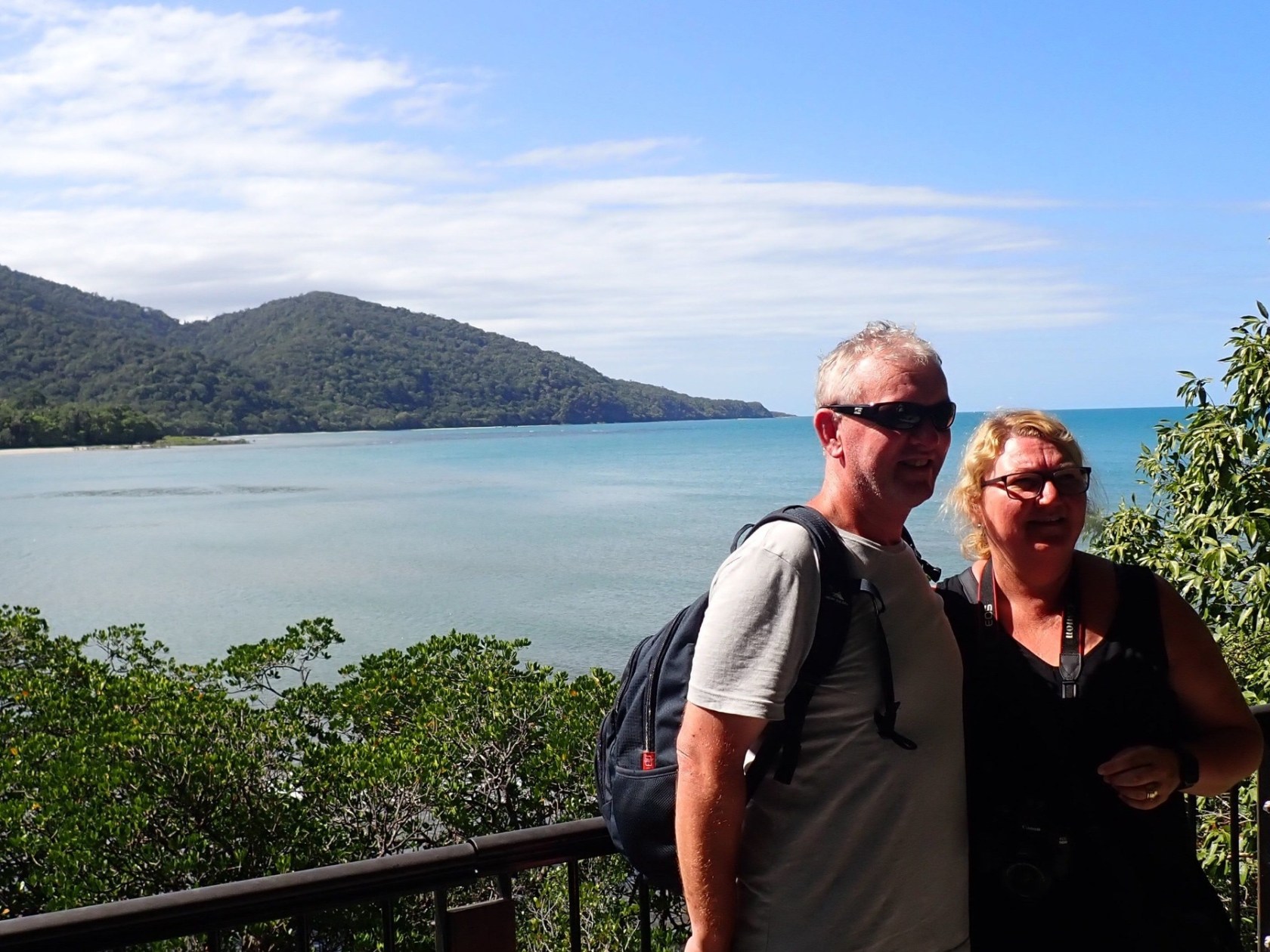 a man standing in front of a lake