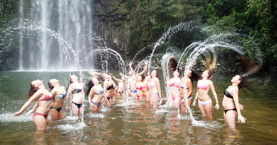a group of people swimming in the water