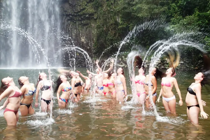 a group of people swimming in the water