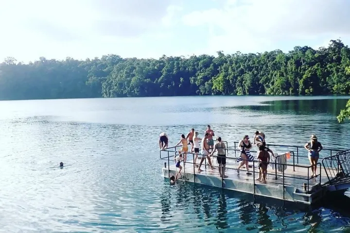 a group of people in a boat on a body of water