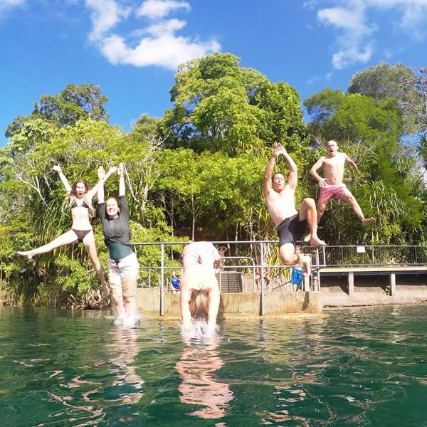 a group of people swimming in the water
