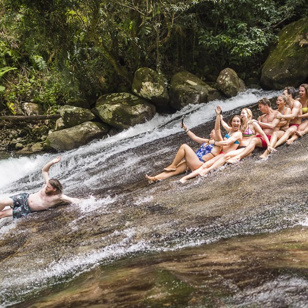 a group of people in a pool of water