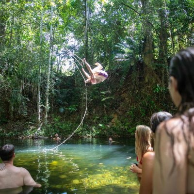 a group of people standing in a river