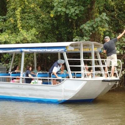 a person riding on the back of a boat