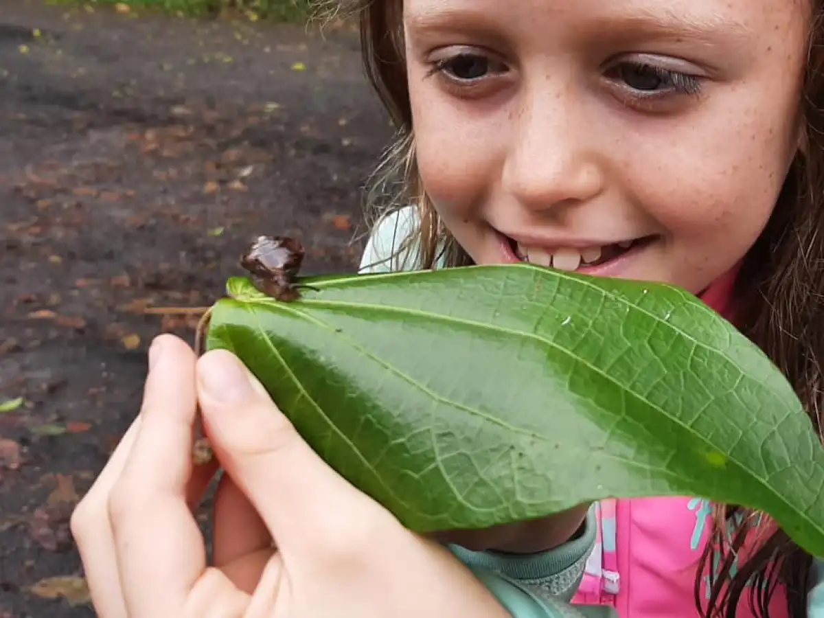 a little girl smiling at the camera