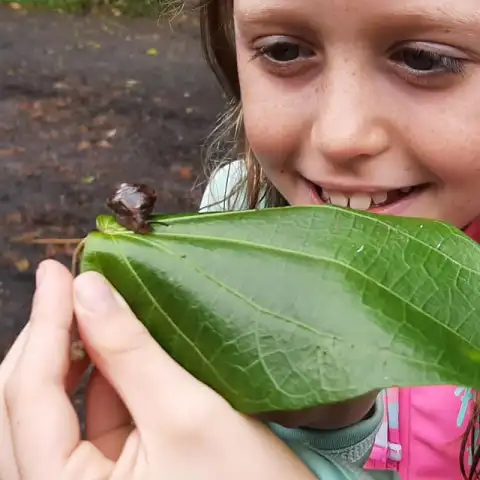 a little girl smiling at the camera