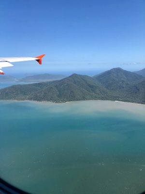 a plane flying over a body of water